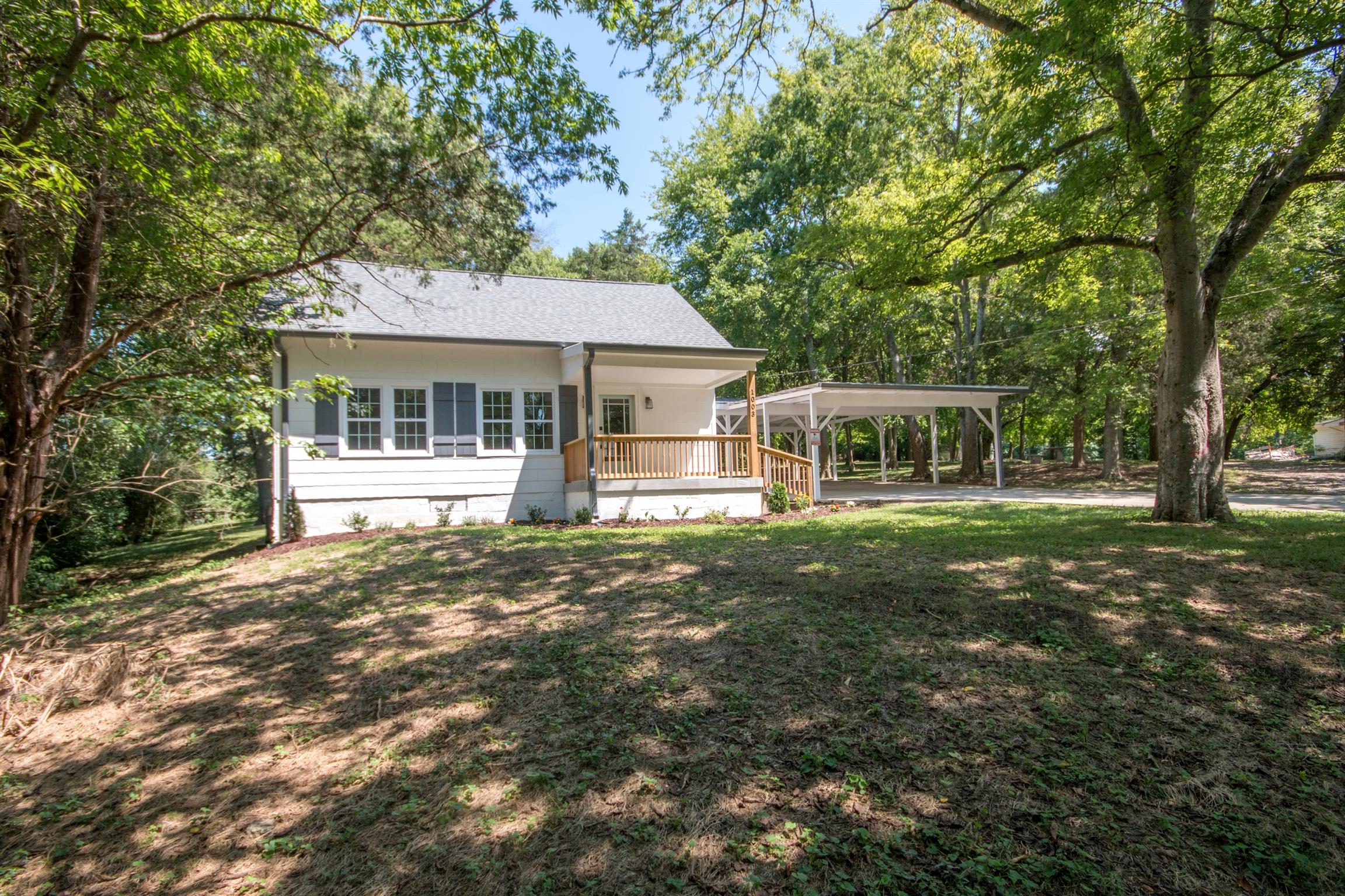 1003 Neelys Bend Road Madison, TN 37115 - Photo 3 of 30 a front view of a house with a garden