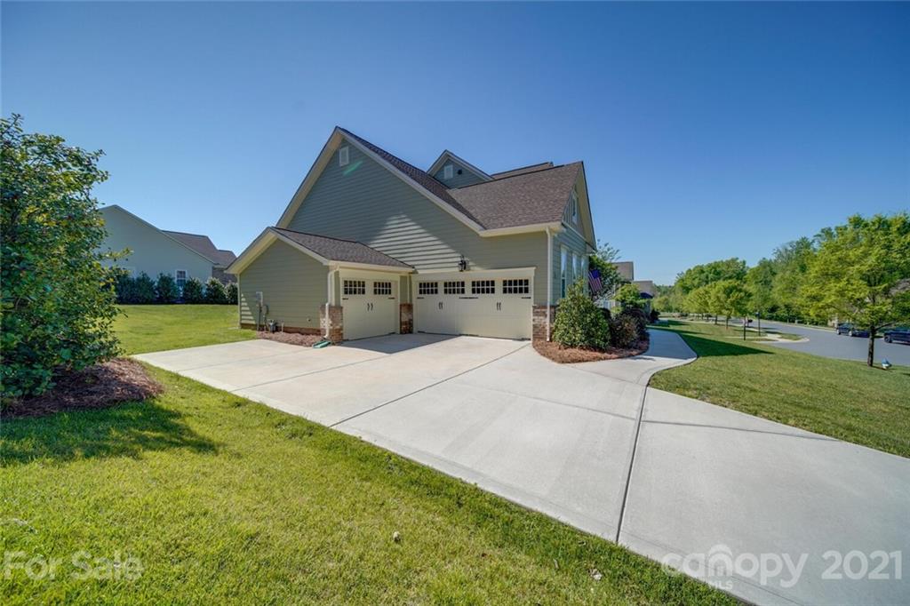 360 Monteray Oaks Circle Fort Mill, SC 29715 - Photo 2 of 44 a front view of a house with garden