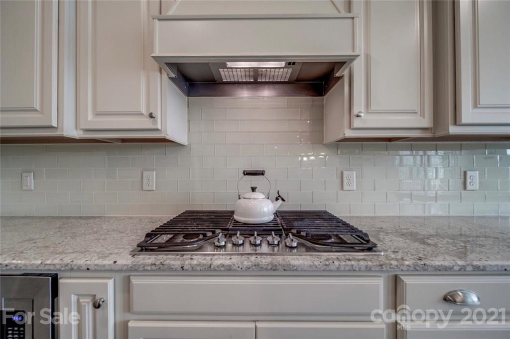 360 Monteray Oaks Circle Fort Mill, SC 29715 - Photo 14 of 44 a stove top oven sitting inside of a kitchen