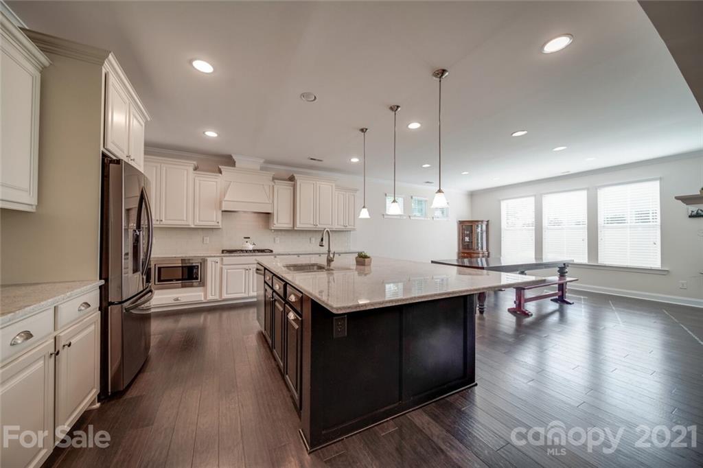 360 Monteray Oaks Circle Fort Mill, SC 29715 - Photo 16 of 44 a kitchen with stainless steel appliances granite countertop a sink stove and refrigerator