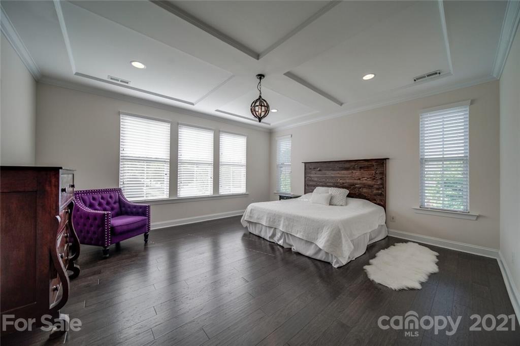 360 Monteray Oaks Circle Fort Mill, SC 29715 - Photo 21 of 44 a spacious bedroom with a bed and a couch