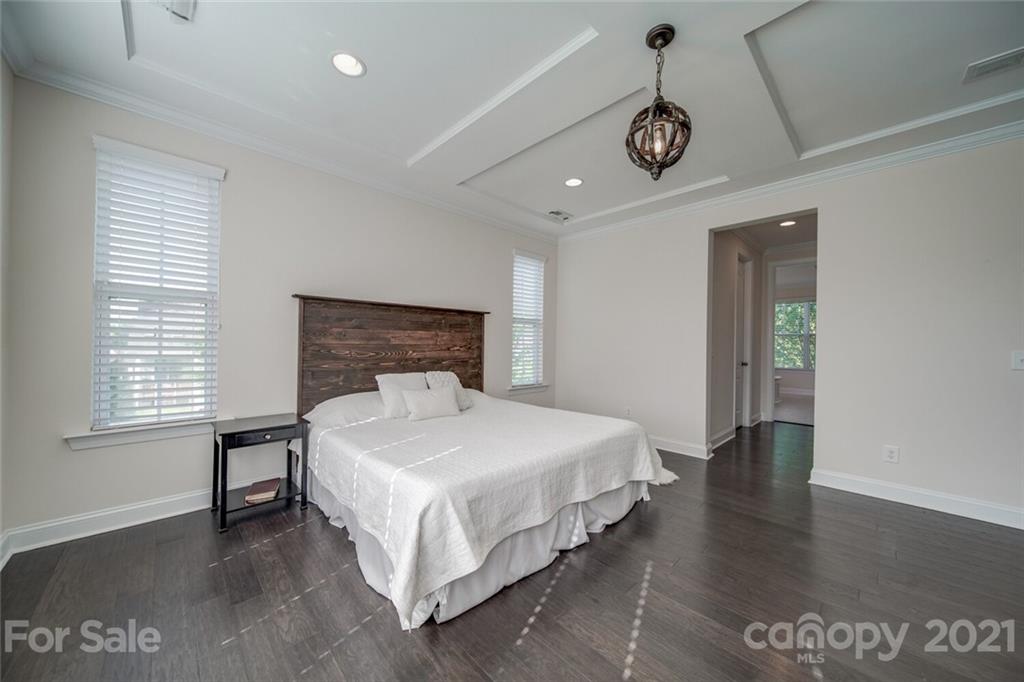 360 Monteray Oaks Circle Fort Mill, SC 29715 - Photo 22 of 44 a bedroom with a bed and a table