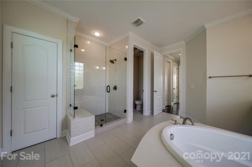 360 Monteray Oaks Circle Fort Mill, SC 29715 - Photo 23 of 44 a bathroom with a tub shower and sink