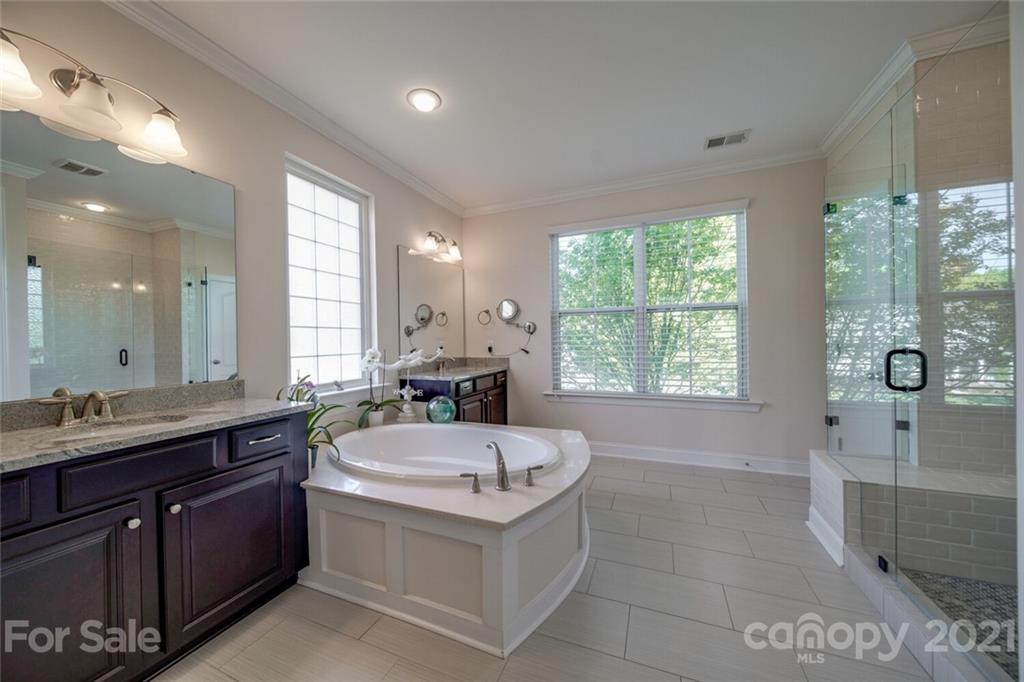 360 Monteray Oaks Circle Fort Mill, SC 29715 - Photo 24 of 44 a bathroom with a tub sink and mirror