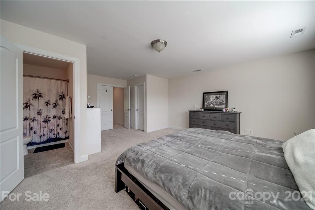 360 Monteray Oaks Circle Fort Mill, SC 29715 - Photo 33 of 44 a bedroom with a large bed and a painting