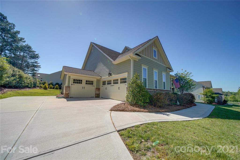 360 Monteray Oaks Circle Fort Mill, SC 29715 - Photo 39 of 44 a front view of a house with a yard and potted plants