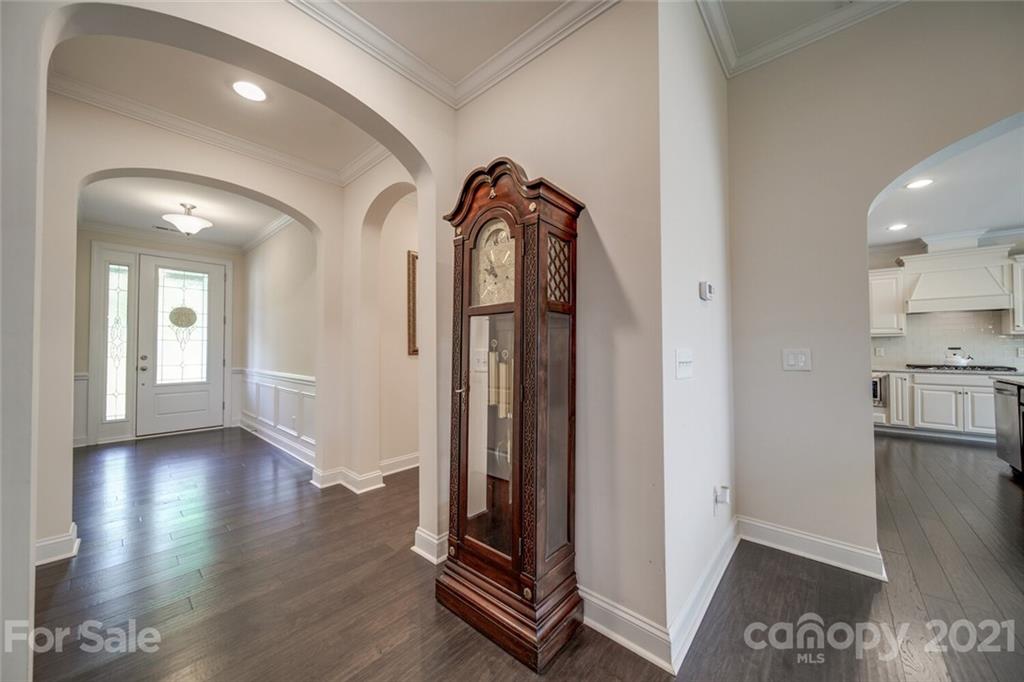 360 Monteray Oaks Circle Fort Mill, SC 29715 - Photo 8 of 44 a view of a hallway with wooden floor and staircase