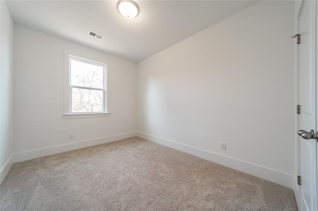 1654 Florence Run Northwest Atlanta, GA 30318 - Photo 11 of 41 an empty room with a window