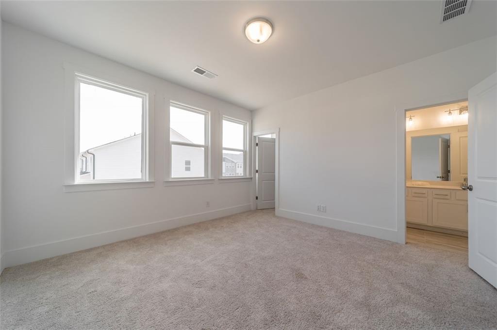 1654 Florence Run Northwest Atlanta, GA 30318 - Photo 12 of 41 an empty room with windows and closet
