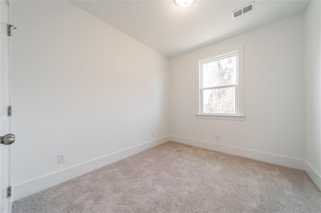 1654 Florence Run Northwest Atlanta, GA 30318 - Photo 13 of 41 an empty room with a window