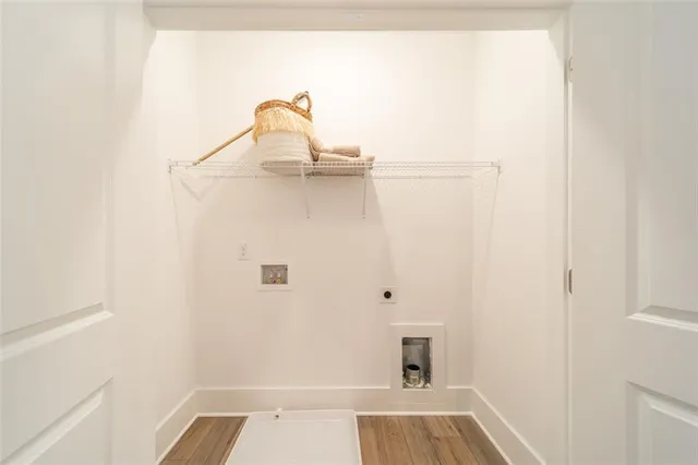 a view of walk in closet with clothes