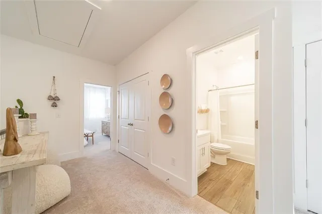 a bathroom with a toilet sink and shower
