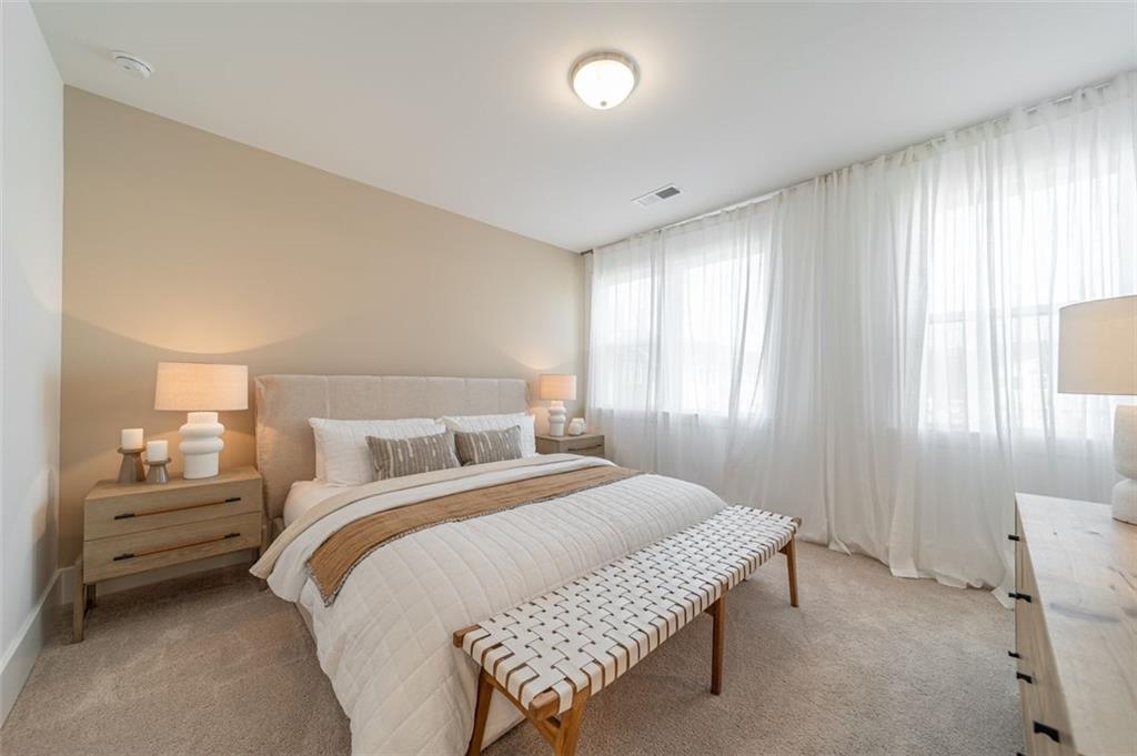 1654 Florence Run Northwest Atlanta, GA 30318 - Photo 20 of 41 a bedroom with a bed and a window