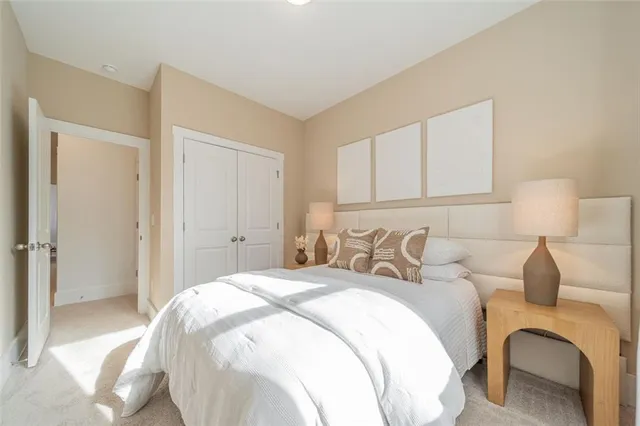 a bedroom with a bed and a couch