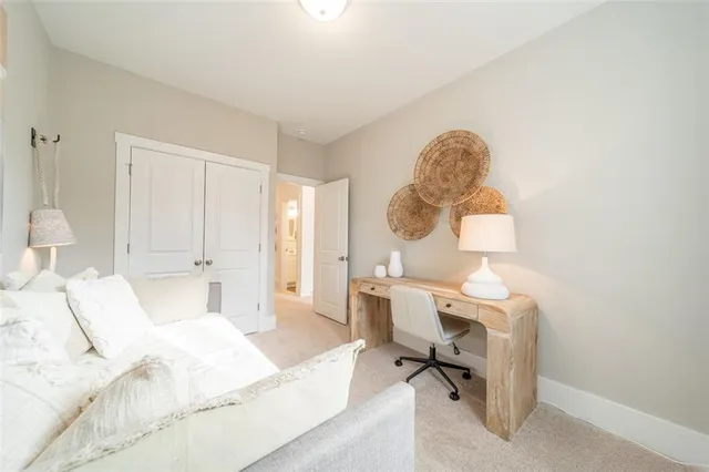 a view of a bedroom with a bed and a chandelier