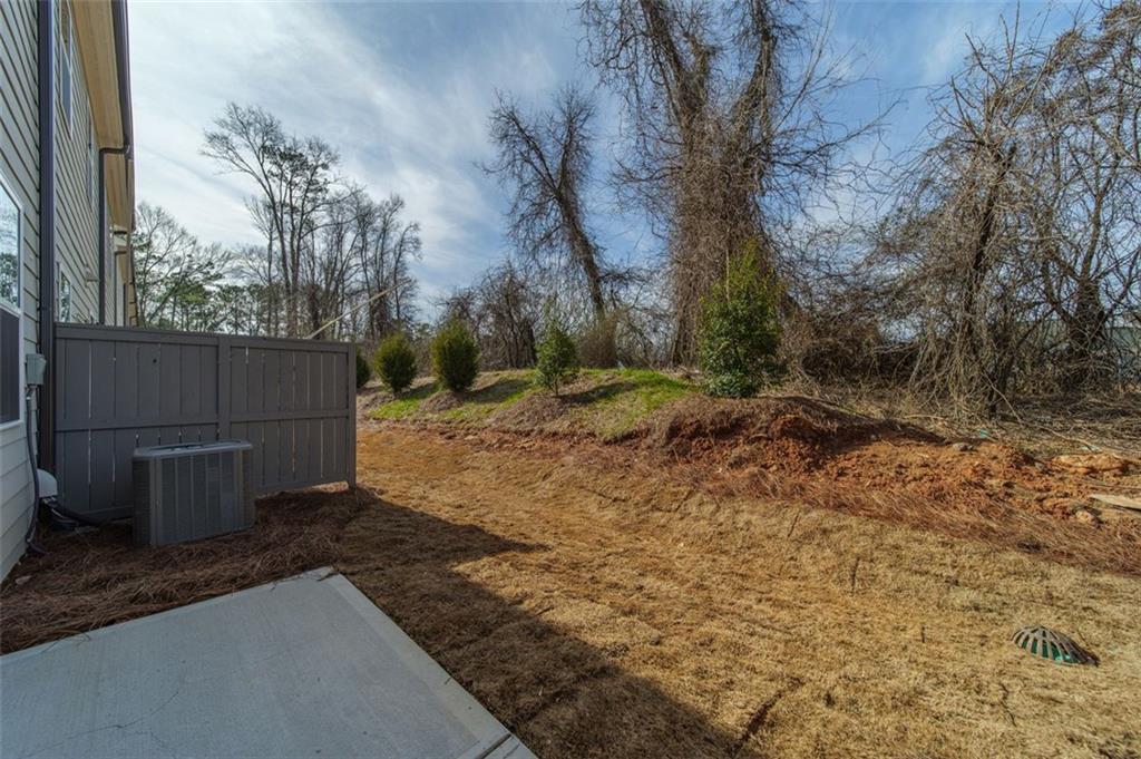 1654 Florence Run Northwest Atlanta, GA 30318 - Photo 32 of 41 a view of backyard and tree