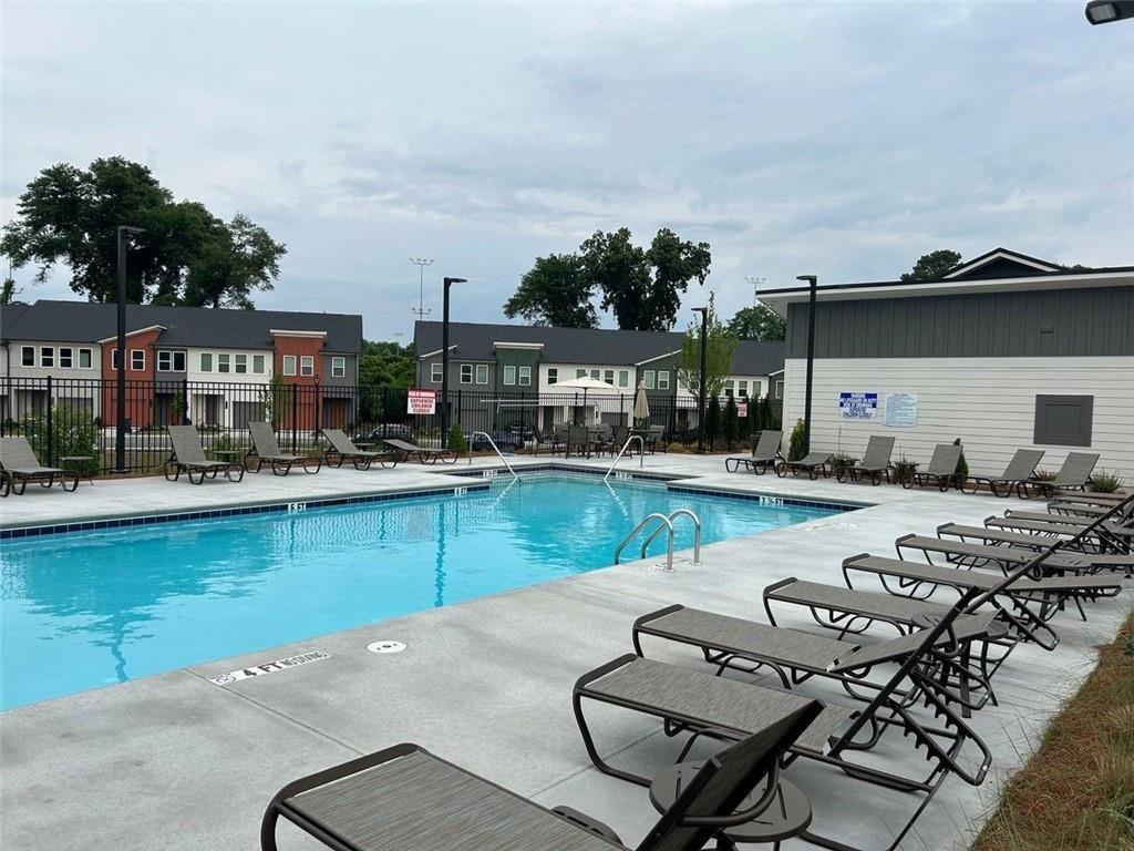 1654 Florence Run Northwest Atlanta, GA 30318 - Photo 35 of 41 a view of a swimming pool with outdoor seating