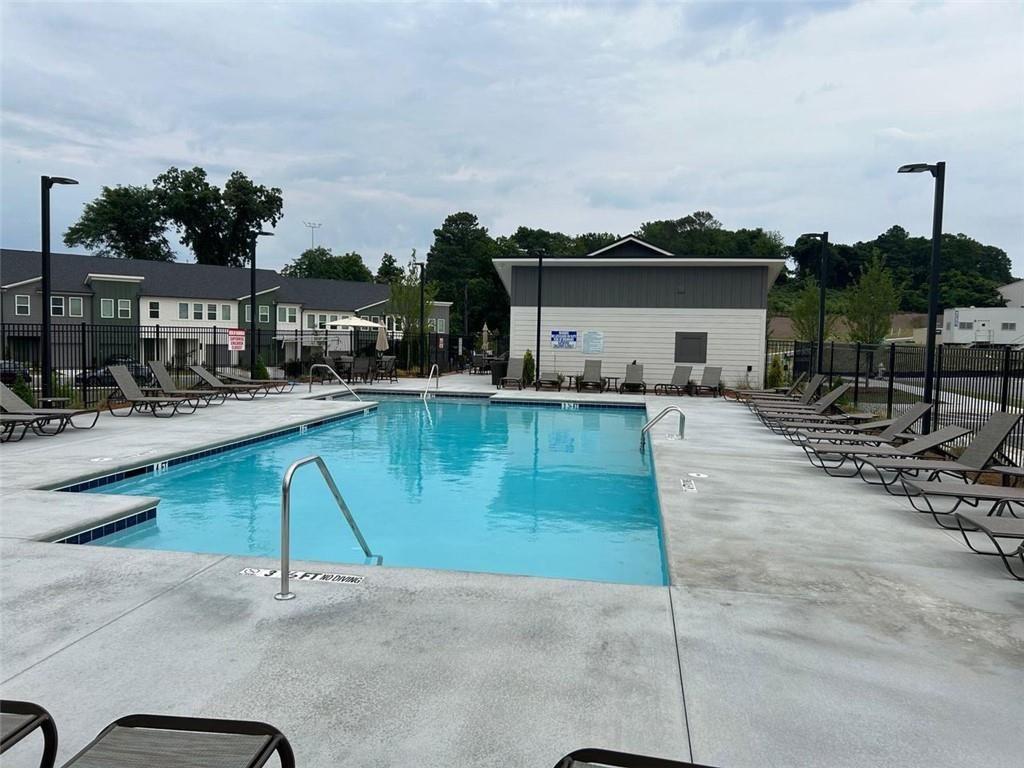 1654 Florence Run Northwest Atlanta, GA 30318 - Photo 36 of 41 a swimming pool with outdoor seating and yard