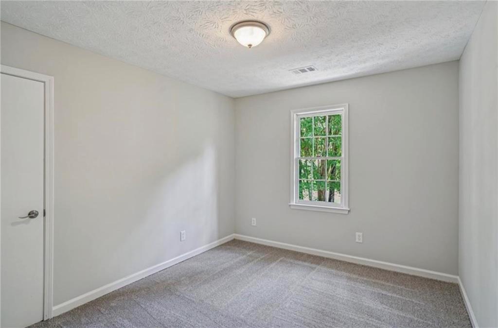 141 Patterson Road Southwest Lawrenceville, GA 30044 - Photo 20 of 34 an empty room with a window