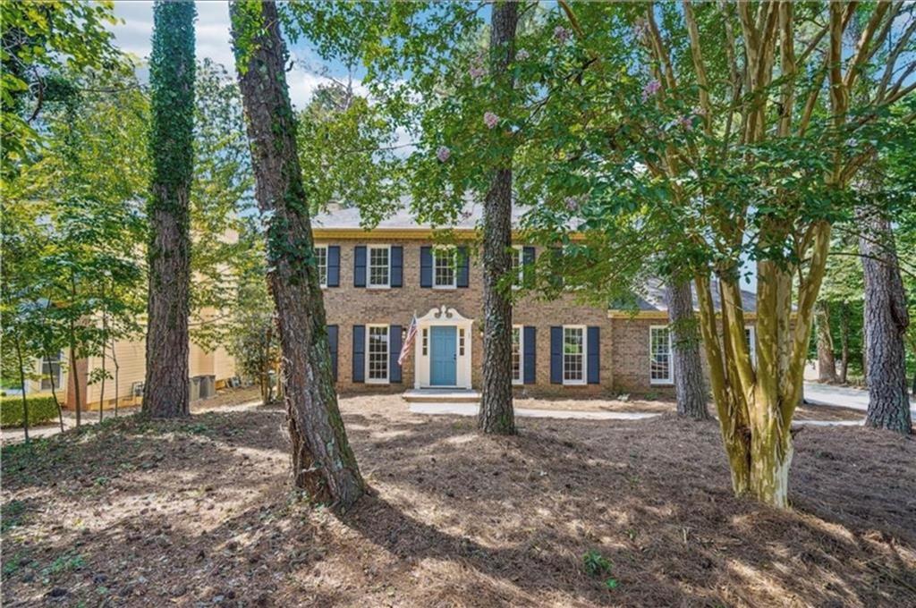 141 Patterson Road Southwest Lawrenceville, GA 30044 - Photo 2 of 34 a front view of a house with a tree