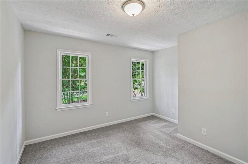 141 Patterson Road Southwest Lawrenceville, GA 30044 - Photo 23 of 34 an empty room with windows