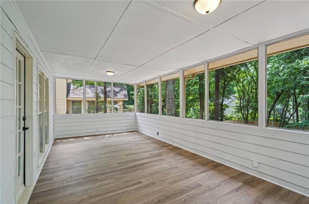 141 Patterson Road Southwest Lawrenceville, GA 30044 - Photo 27 of 34 a view of an empty room with wooden floor and a window