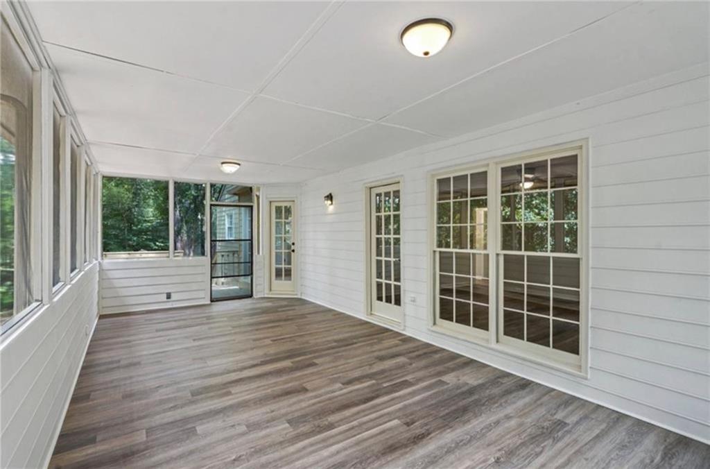 141 Patterson Road Southwest Lawrenceville, GA 30044 - Photo 28 of 34 a view of an empty room with wooden floor and a window
