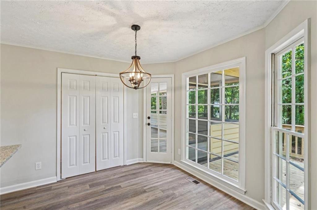 141 Patterson Road Southwest Lawrenceville, GA 30044 - Photo 7 of 34 a view of empty room with windows