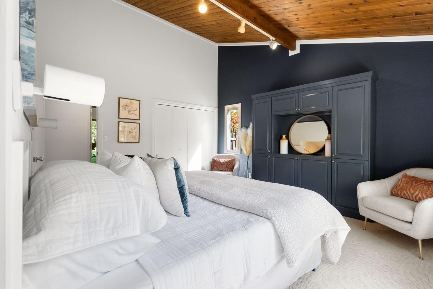 886 Berkeley Avenue Menlo Park, CA 94025 - Photo 15 of 46 a bedroom with a bed and a mirror