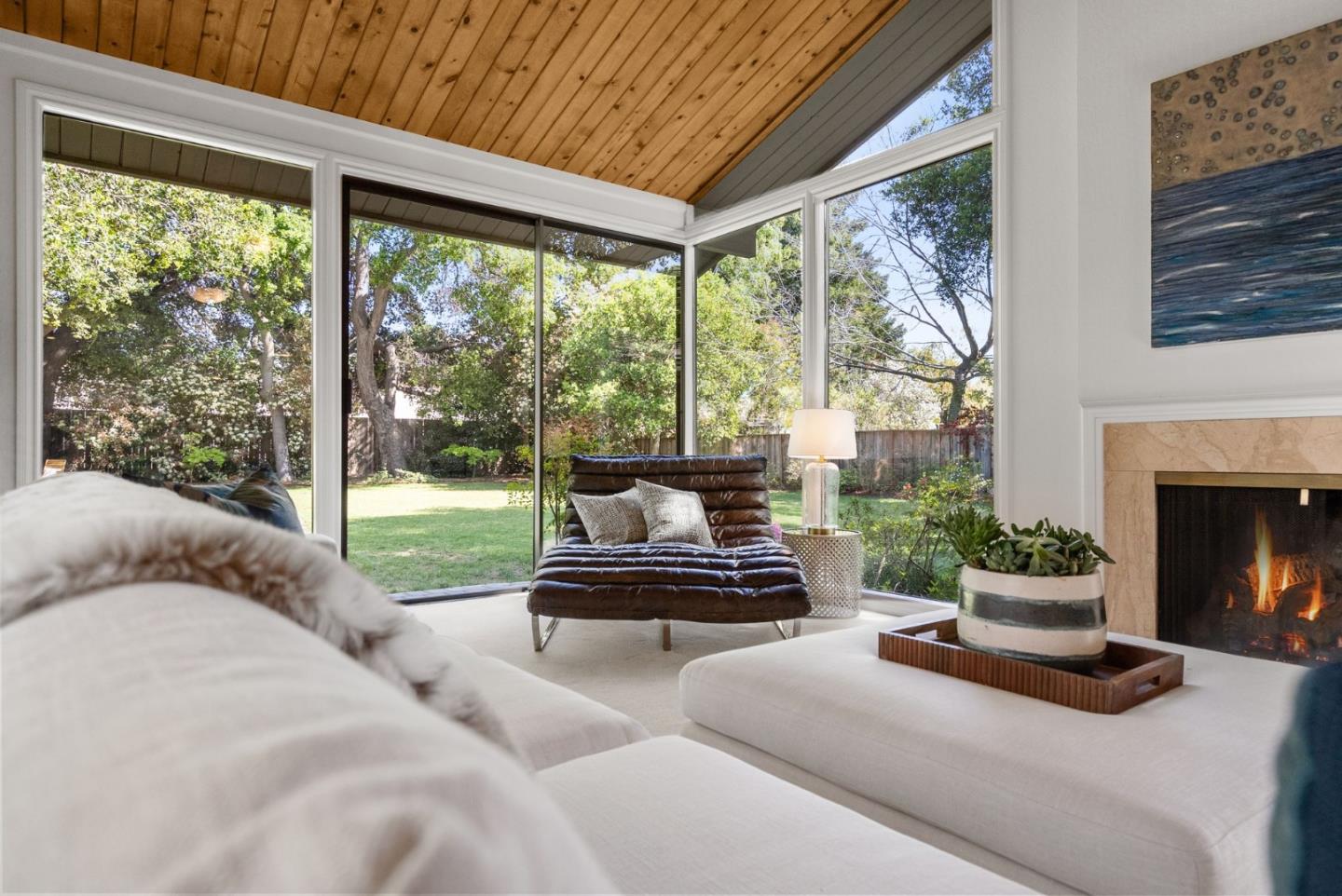 886 Berkeley Avenue Menlo Park, CA 94025 - Photo 2 of 46 a living room with furniture and a fireplace