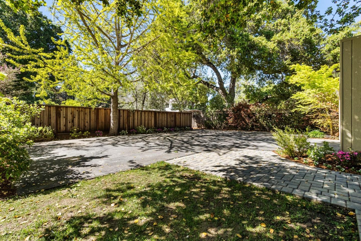 886 Berkeley Avenue Menlo Park, CA 94025 - Photo 26 of 46 a view of a backyard with large trees and plants