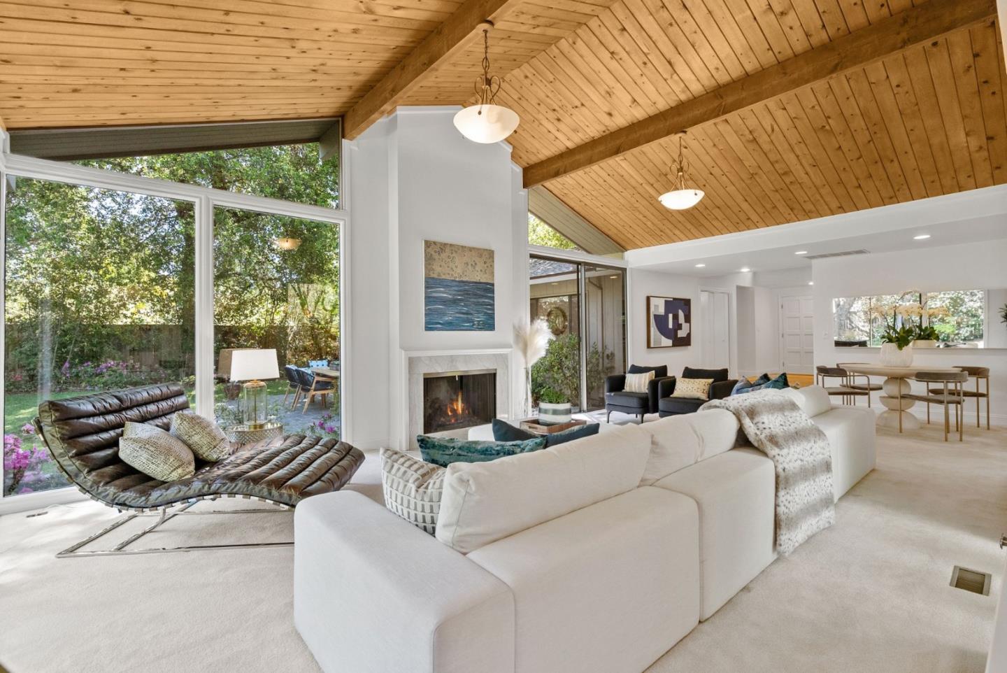 886 Berkeley Avenue Menlo Park, CA 94025 - Photo 3 of 46 a living room with furniture fireplace and floor to ceiling windows
