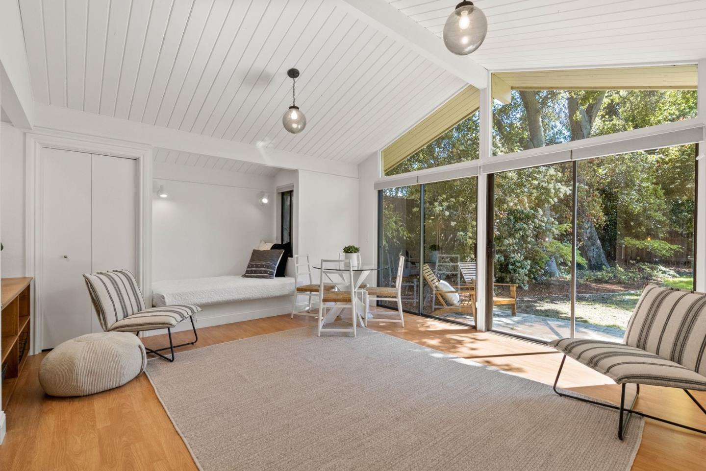 886 Berkeley Avenue Menlo Park, CA 94025 - Photo 38 of 46 a living room with furniture and a large window
