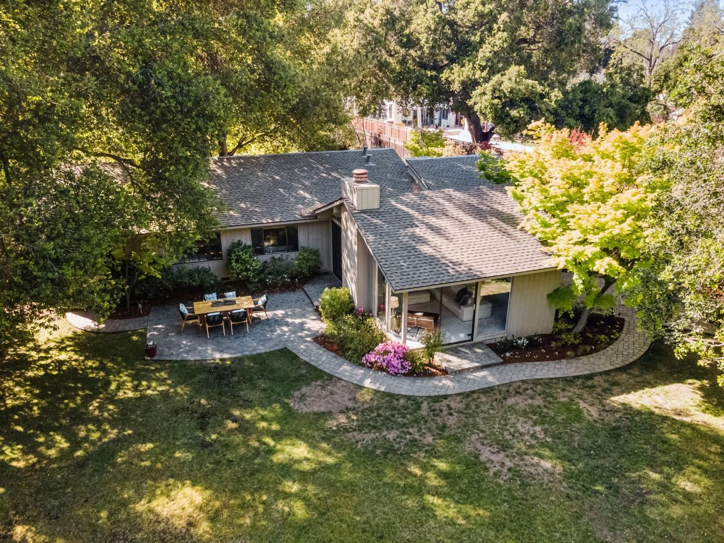 886 Berkeley Avenue Menlo Park, CA 94025 - Photo 45 of 46 a view of a house with backyard water fountain and sitting area