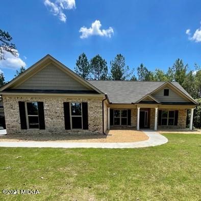 249 Castleberry Road Forsyth, GA 31029 - Photo 1 of 5 a front view of house with yard outdoor seating and green space