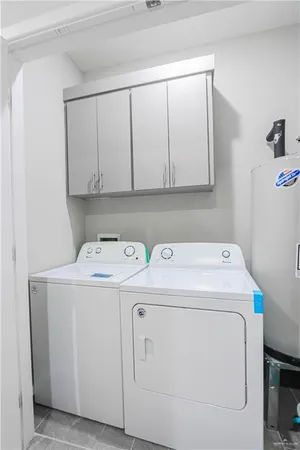 a bedroom with a bed and a lamp