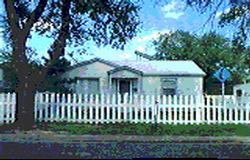 4015 Bowie Street Amarillo, TX 79110 - Photo 1 of 1 a front view of a house with a garden