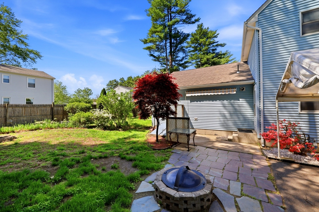 19-21 Wedgewood Circle Springfield, MA 01129 - Photo 5 of 32 a backyard of a house with barbeque oven table and chairs