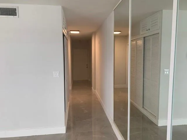 a view of a hallway with elevator