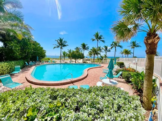 a view of a swimming pool with a yard