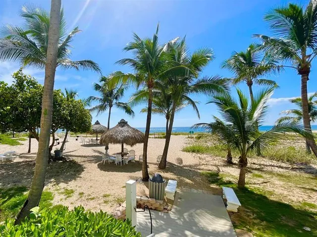 a view of swimming pool with a table and chairs