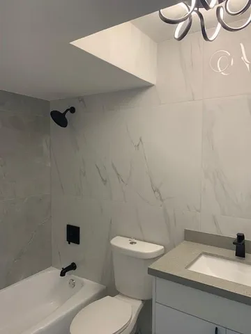 a bathroom with a sink and a toilet