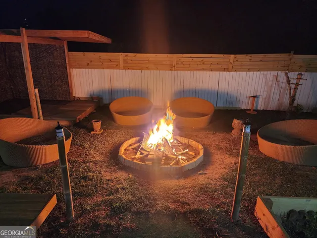 a table with chairs and a lamp