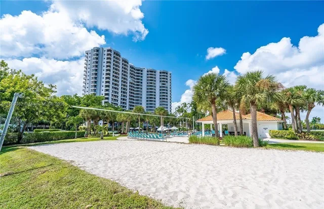 a living room with furniture and flowers