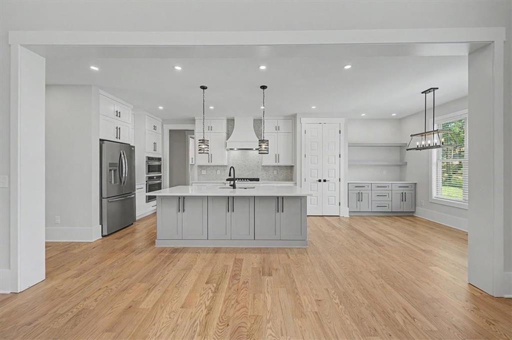 217 Laura Lake Road Marietta, GA 30066 - Photo 14 of 54 a large kitchen with a center island stainless steel appliances and a counter space