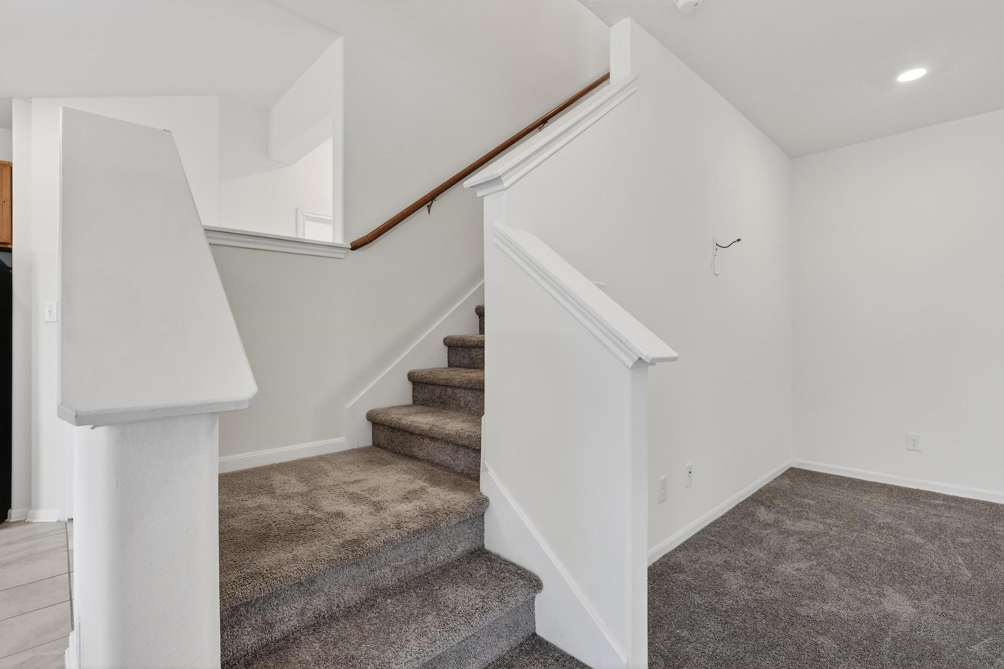 3322 Nila Creek Dr Spring Spring, TX 77373 - Photo 14 of 36 Staircase and hallway area leading to the second floor with easy access to the main living spaces.