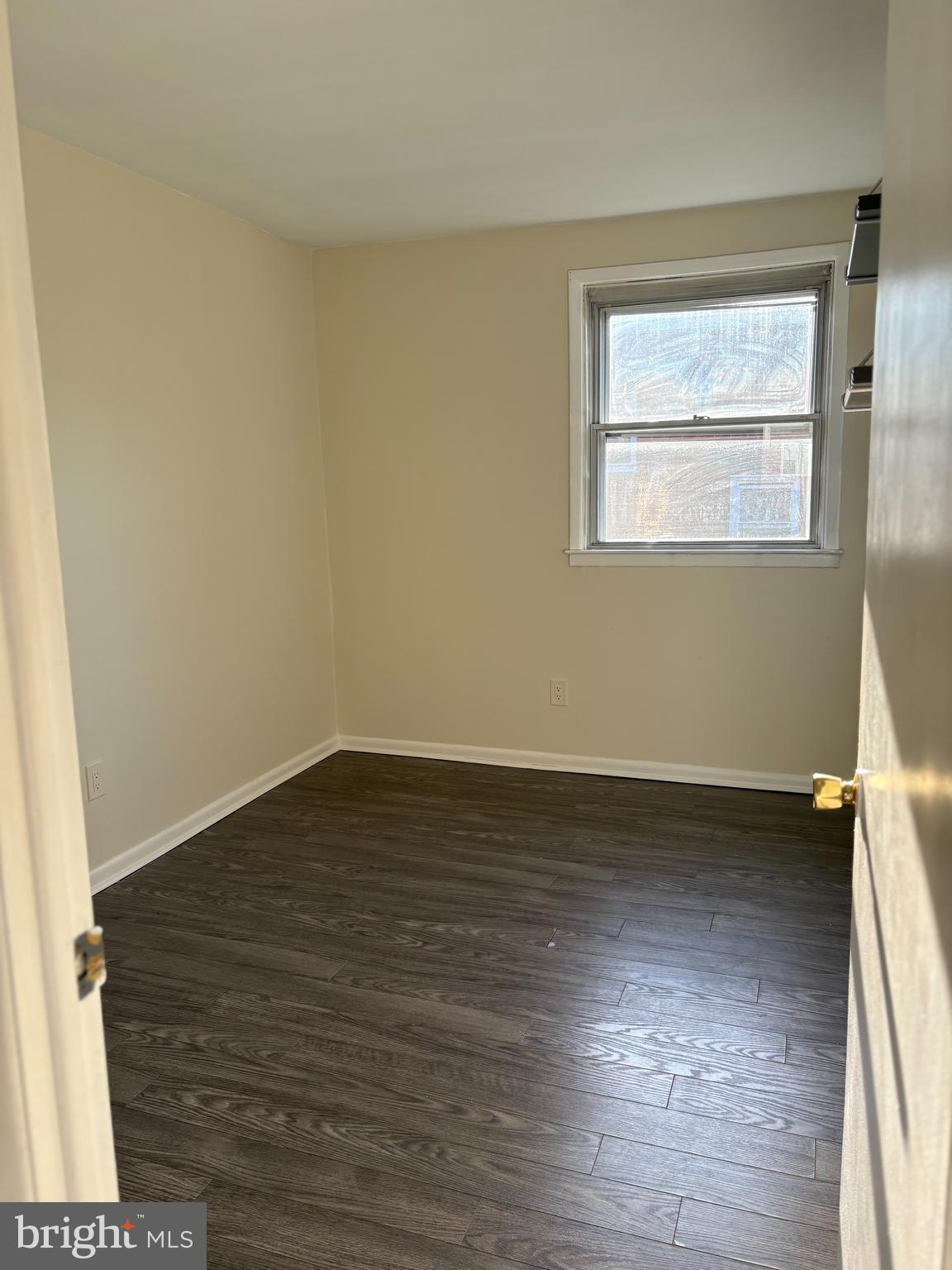 261 Ridgeway Terrace Philadelphia, PA 19116 - Photo 12 of 15 a view of an empty room with wooden floor and a window