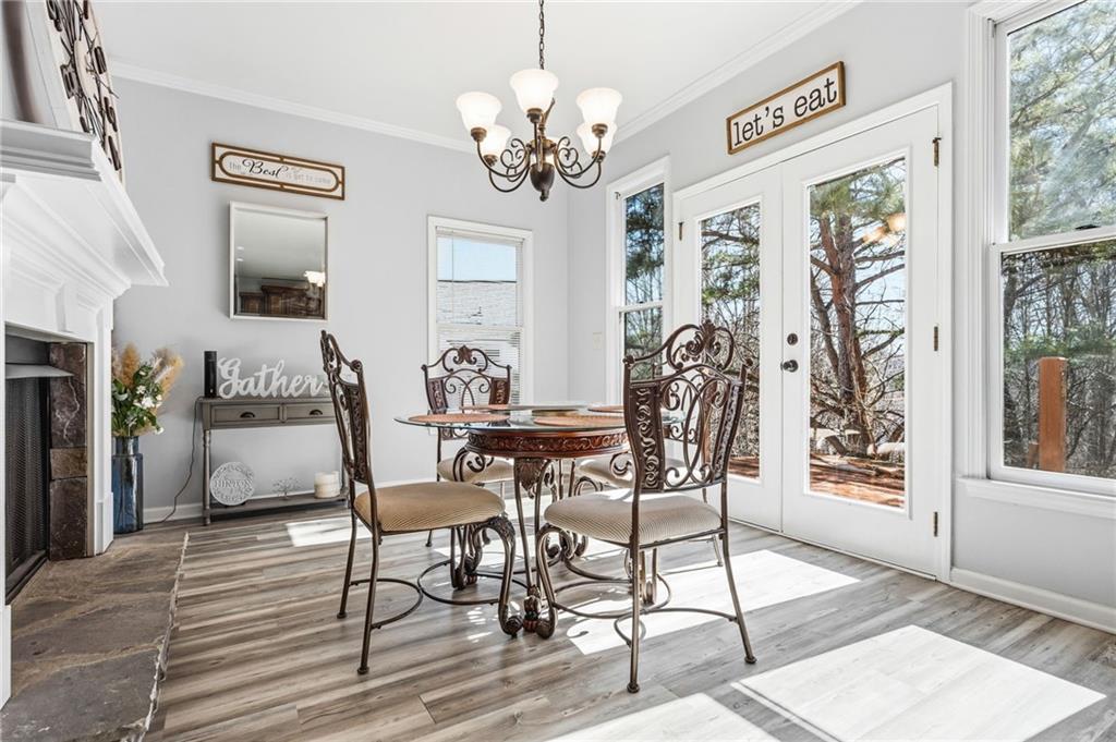 313 Spring Hill Drive Canton, GA 30115 - Photo 11 of 35 a view of a dining room with furniture window and wooden floor