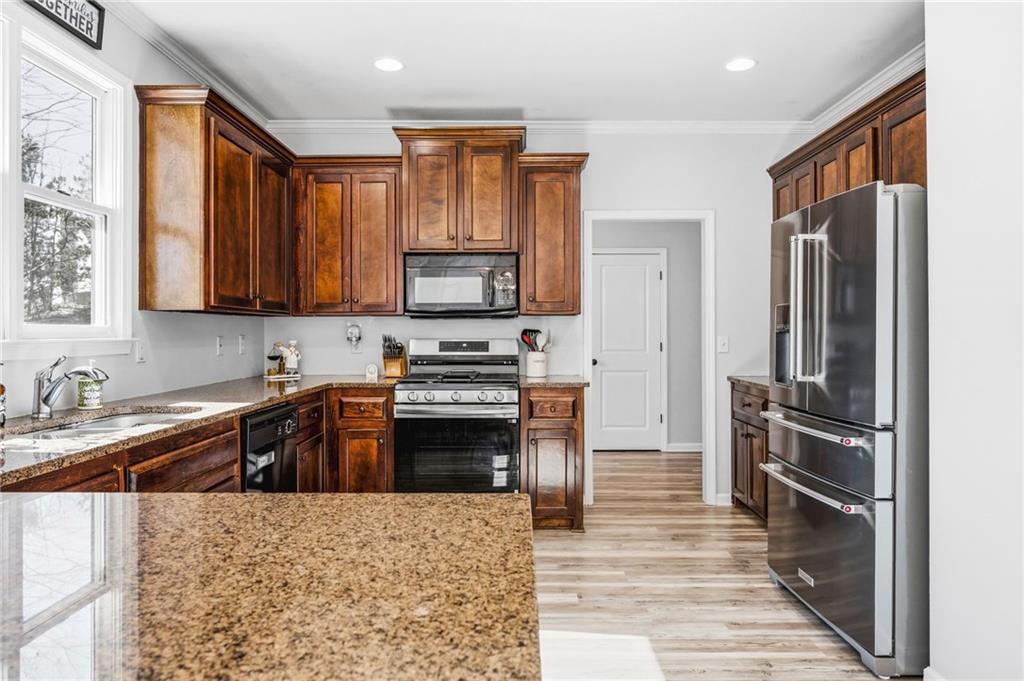 313 Spring Hill Drive Canton, GA 30115 - Photo 13 of 35 a kitchen with a refrigerator stove and sink