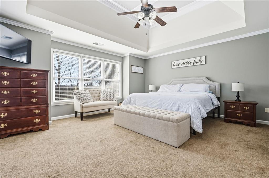 313 Spring Hill Drive Canton, GA 30115 - Photo 18 of 35 a spacious bedroom with a bed and a dresser